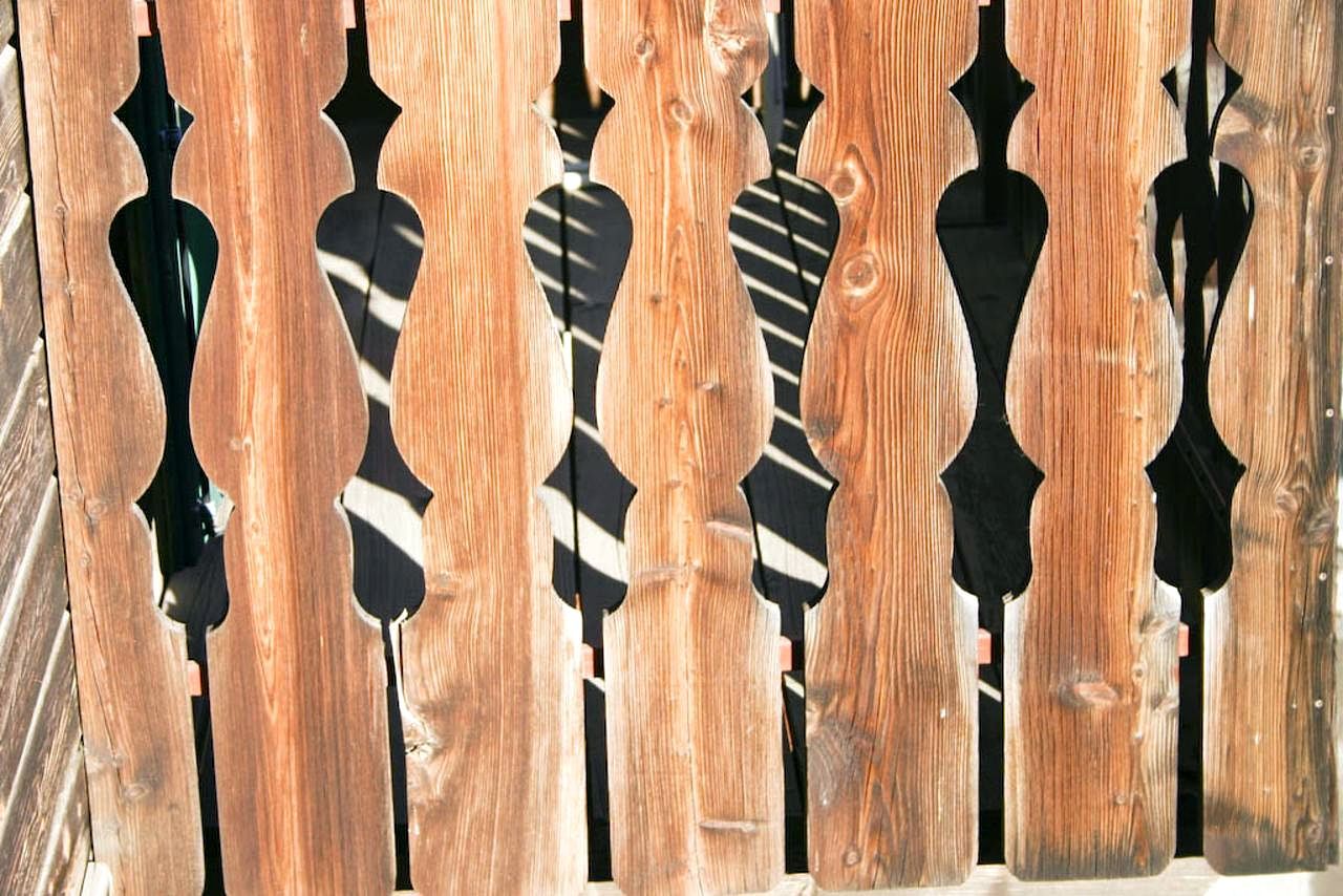 Close-up of decorative timber fence boards, an illustrative image